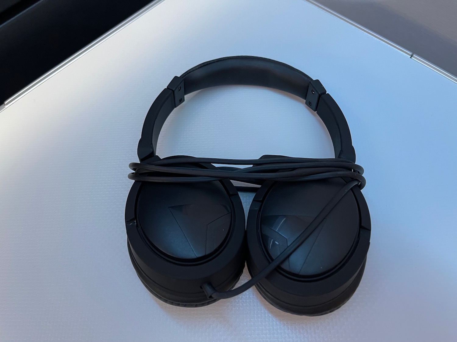 a pair of black headphones with a wire