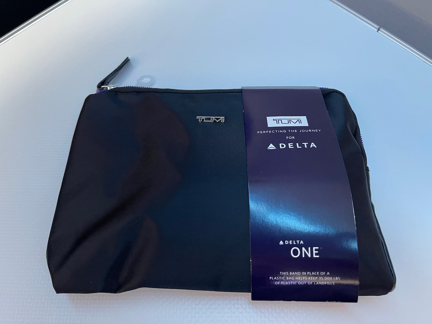 a black bag with a blue label on it