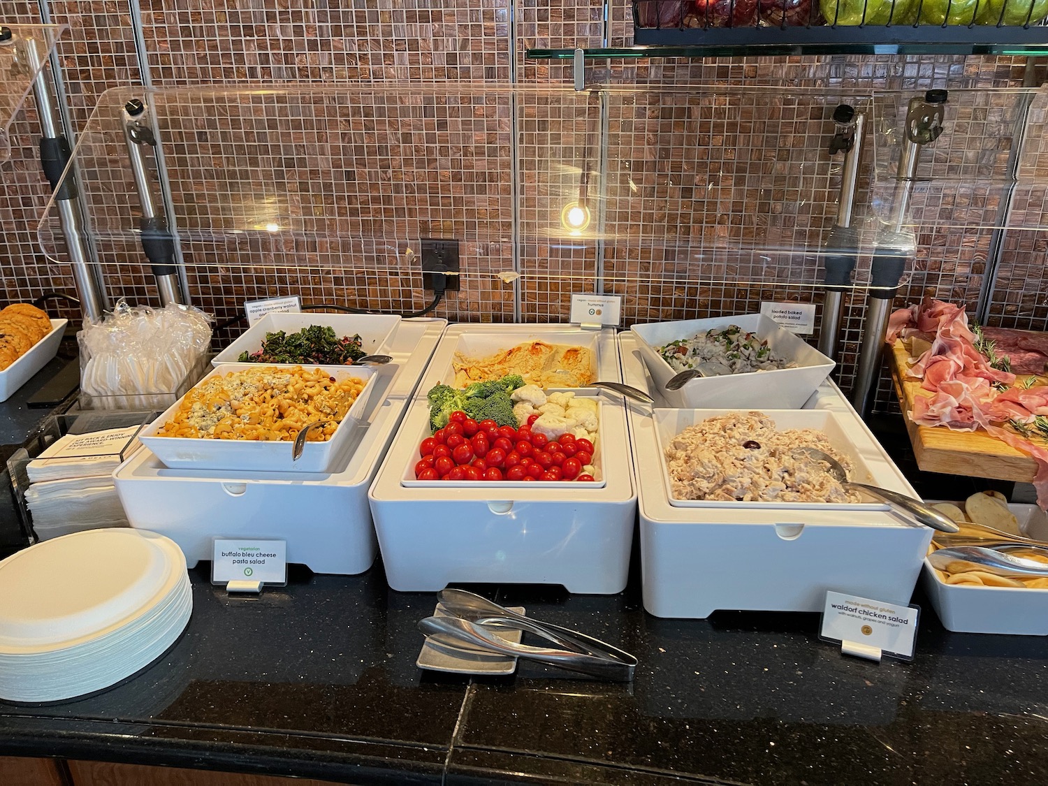 a buffet with different food in containers