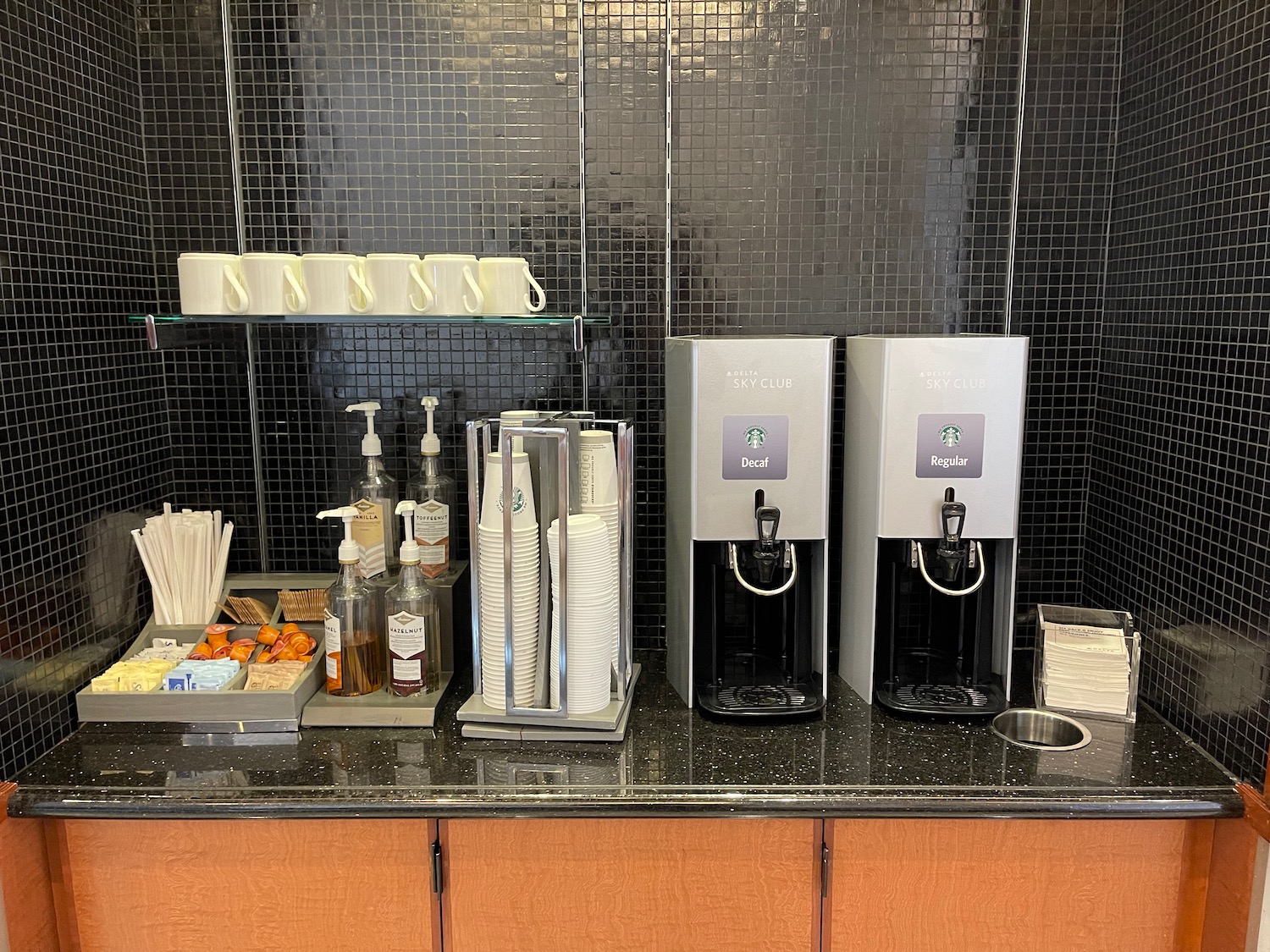 a coffee machine and coffee cups on a counter