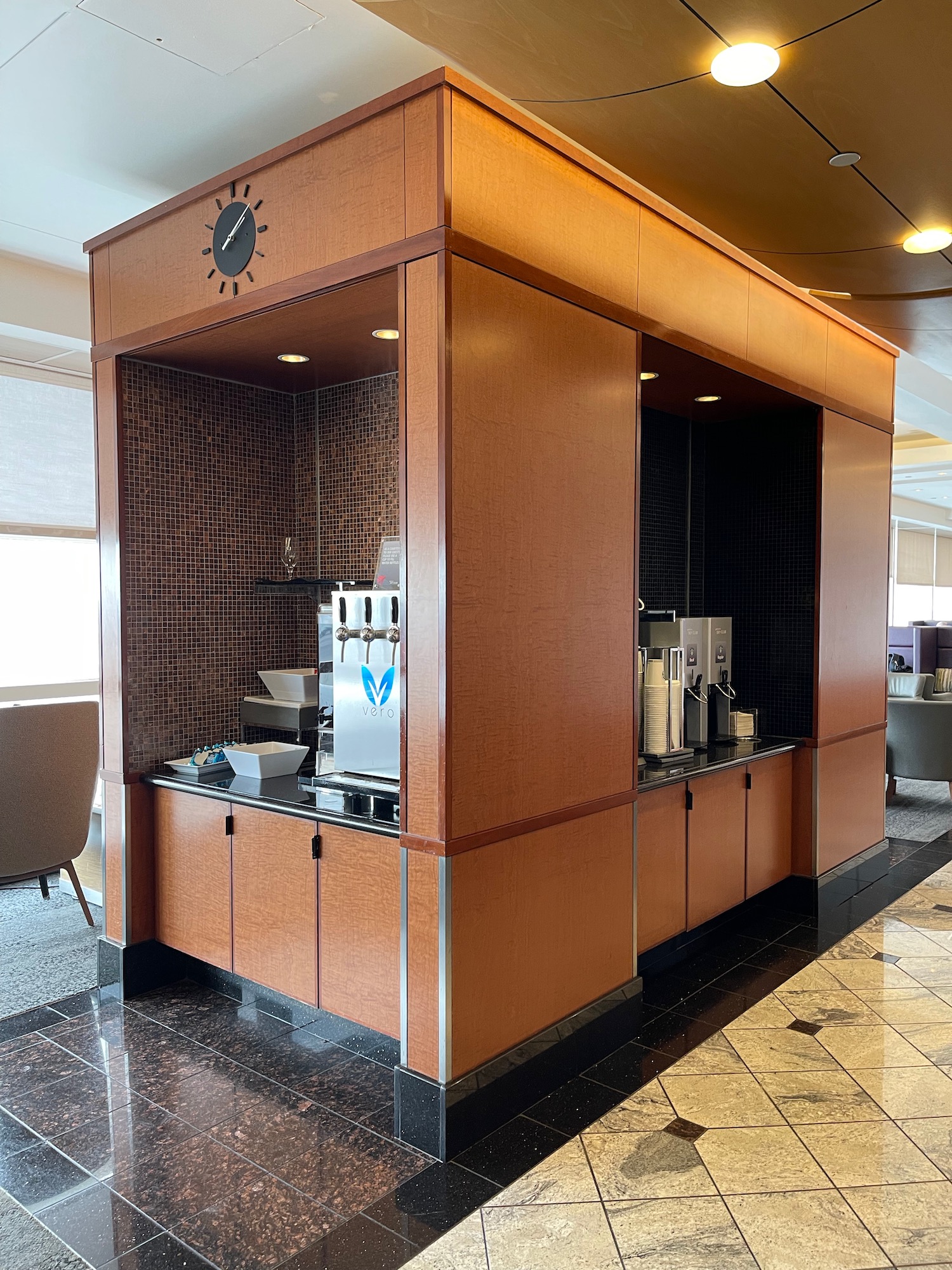 a room with a coffee machine and a clock