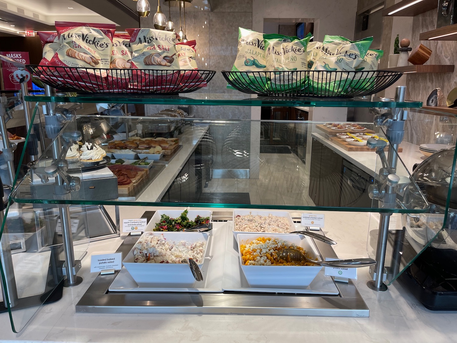 a glass display case with food on it