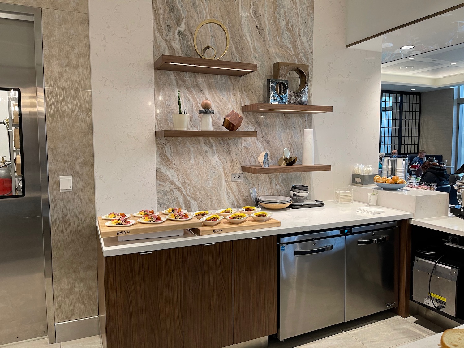 a kitchen with a counter top and shelves