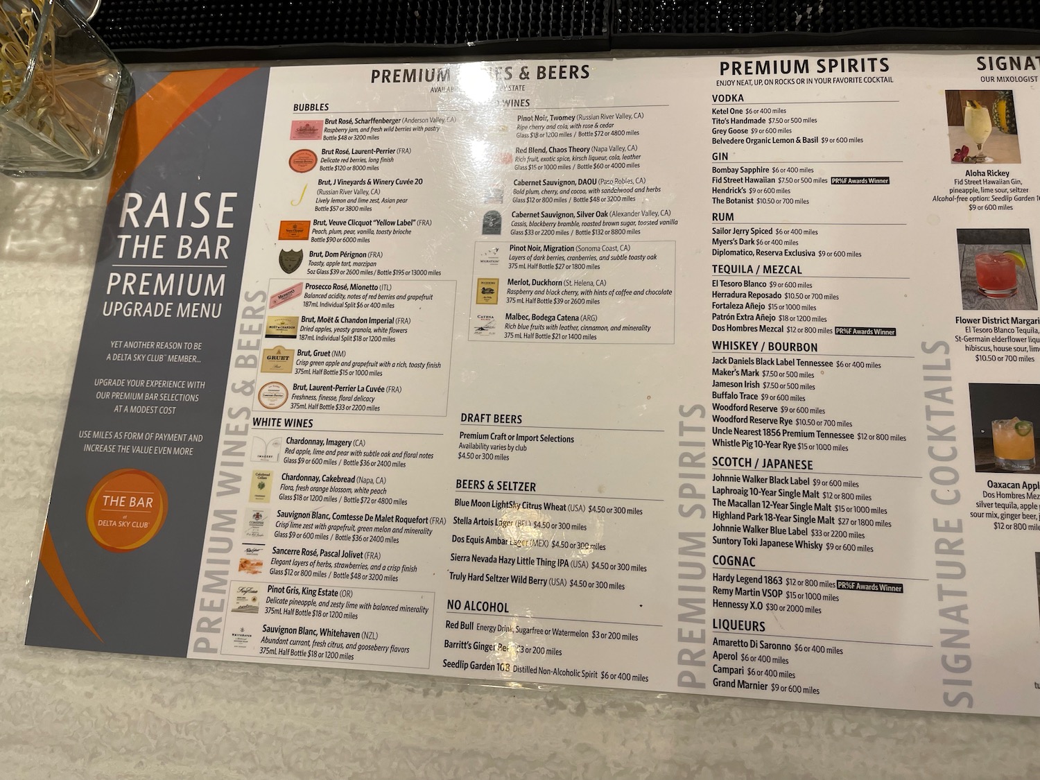 a menu sign with black text and white text