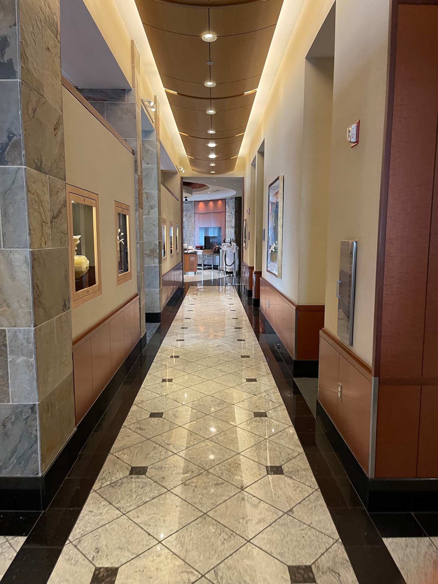 a hallway with a tile floor and a tile floor