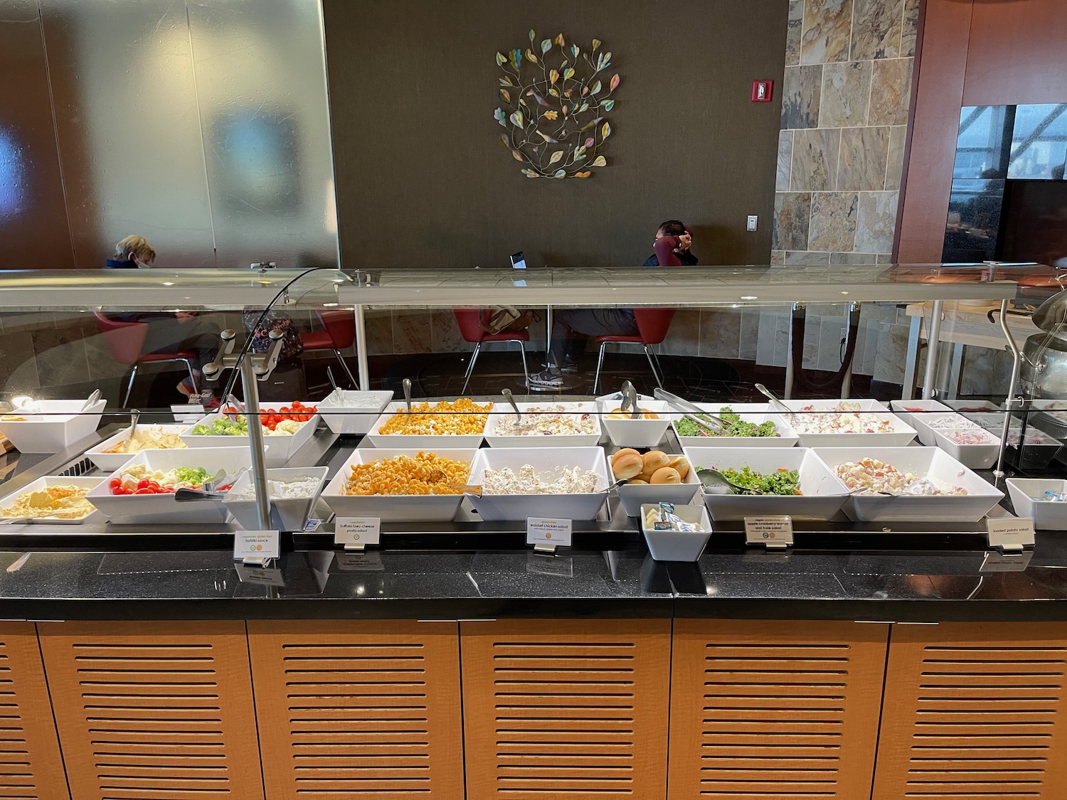 a buffet line with food in containers