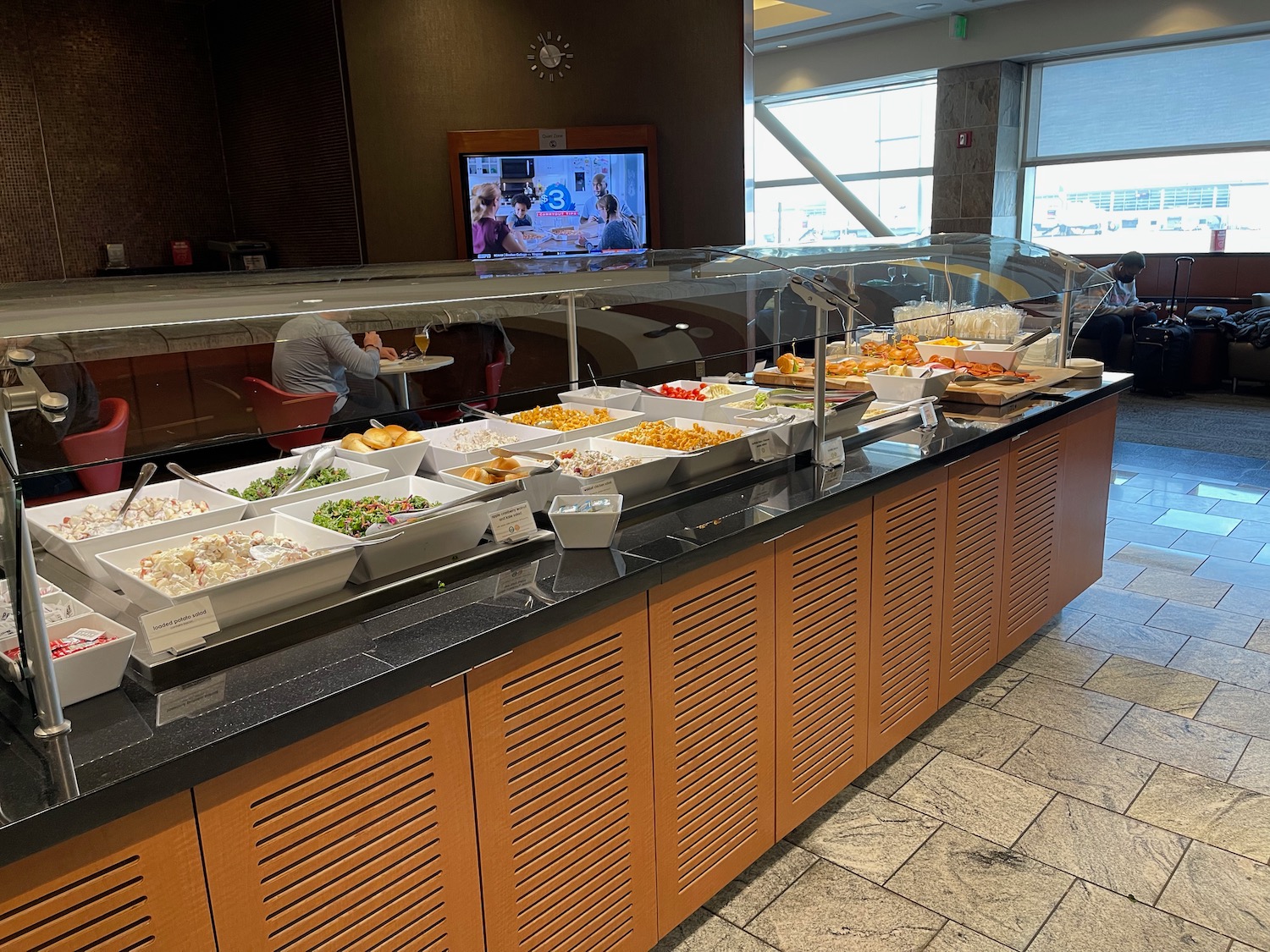 a buffet line with food in bowls