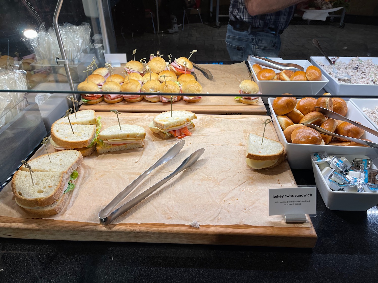 a tray of sandwiches and other food on a table