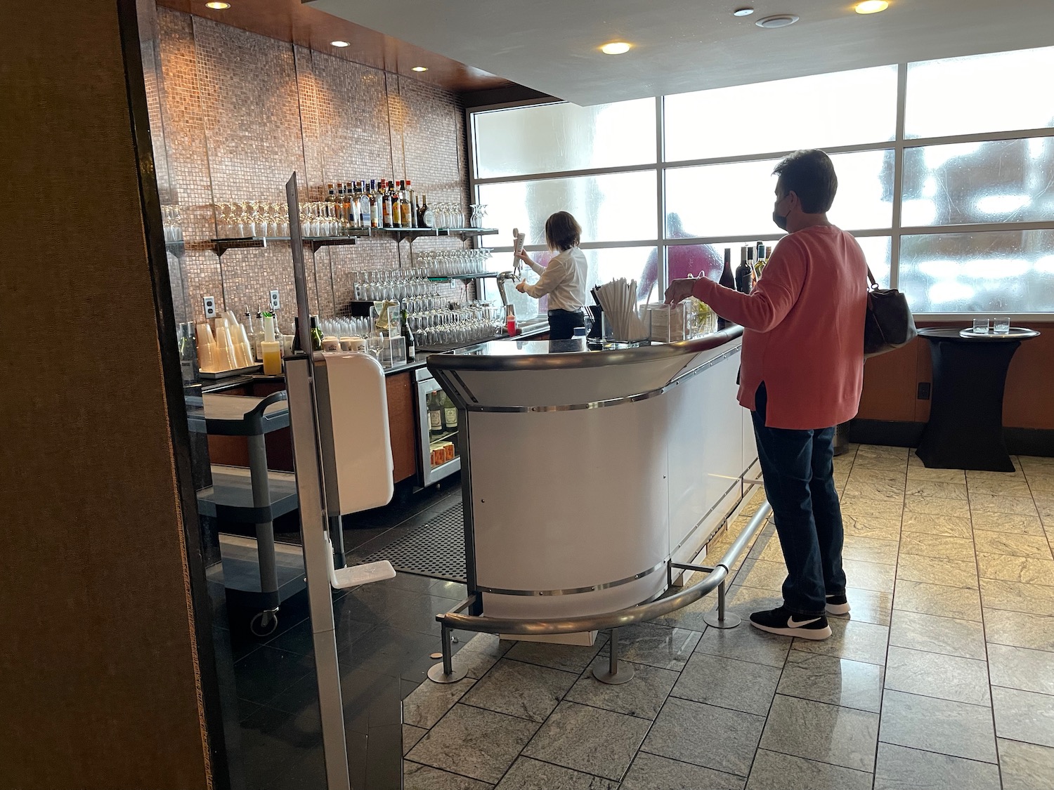 a man standing at a bar