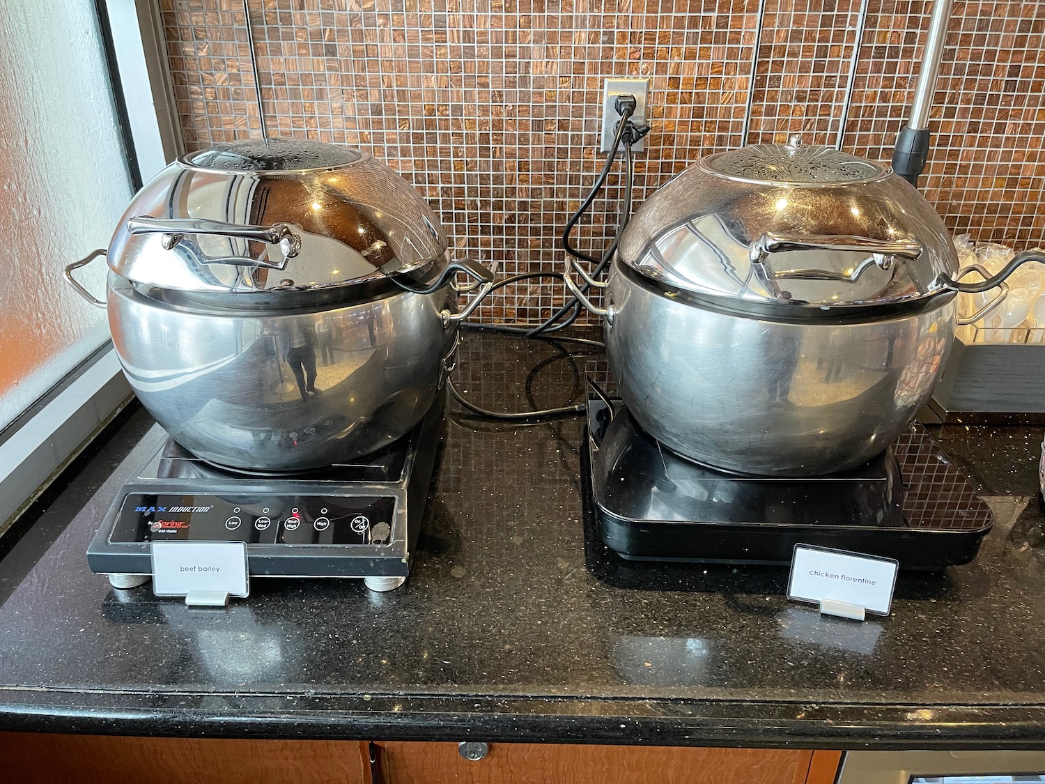 two large pots on a counter