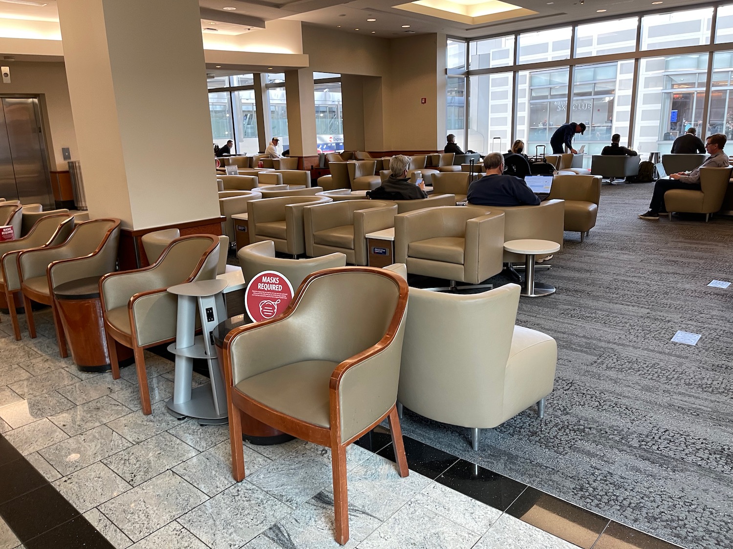 a group of people sitting in a lounge area