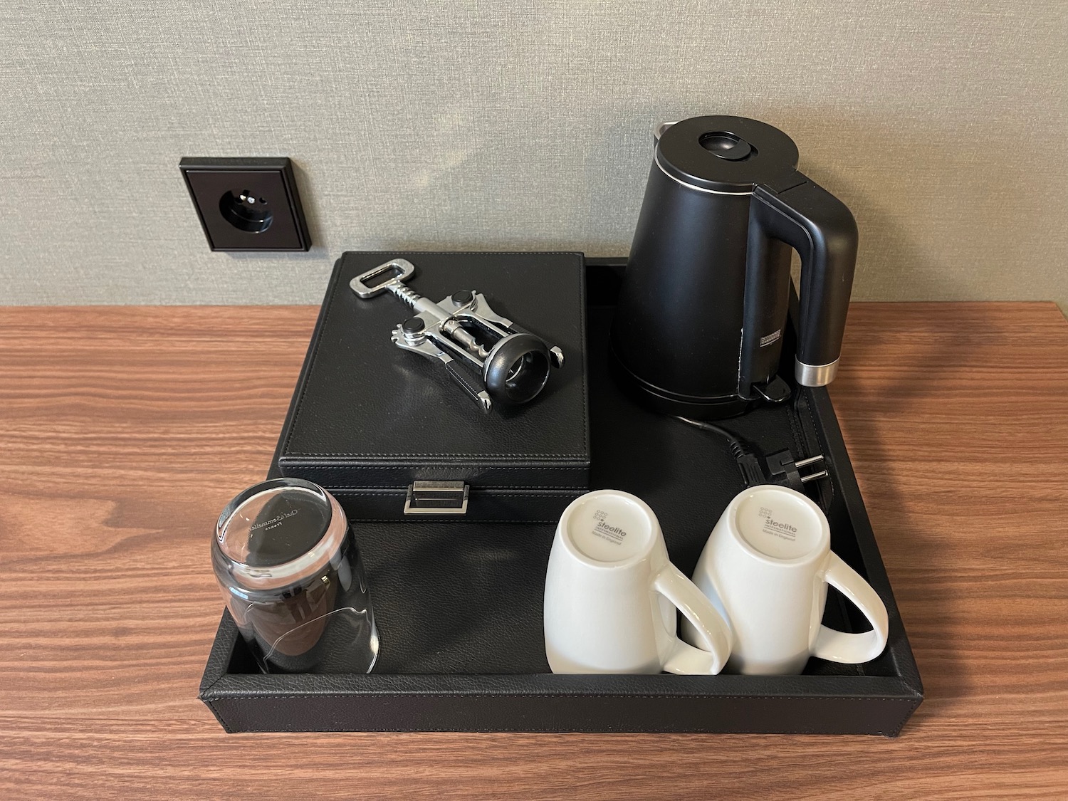 a tray with coffee pots and mugs