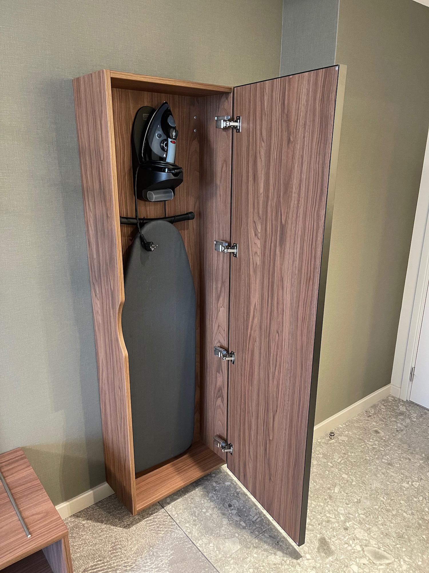 a wooden cabinet with a surfboard inside