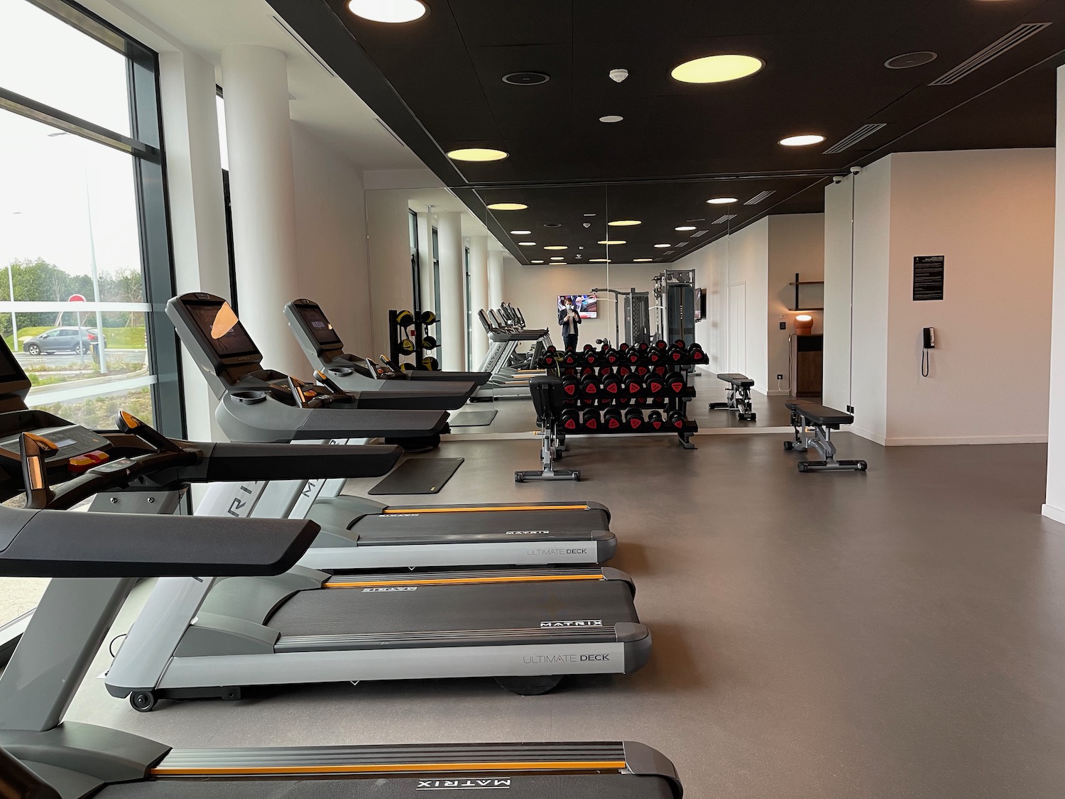 a room with treadmills and exercise equipment