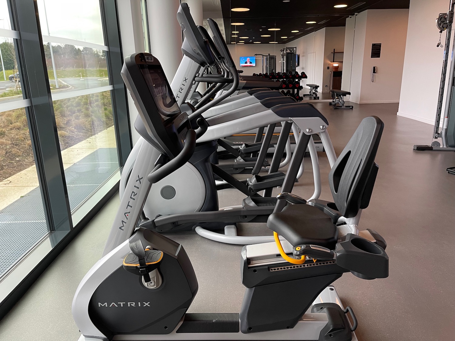 a group of exercise machines in a room