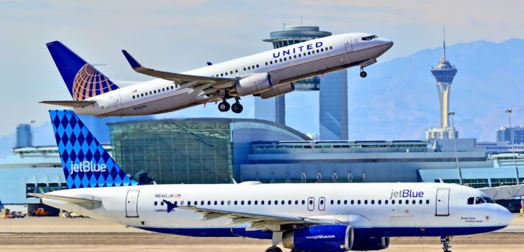 two airplanes on a runway