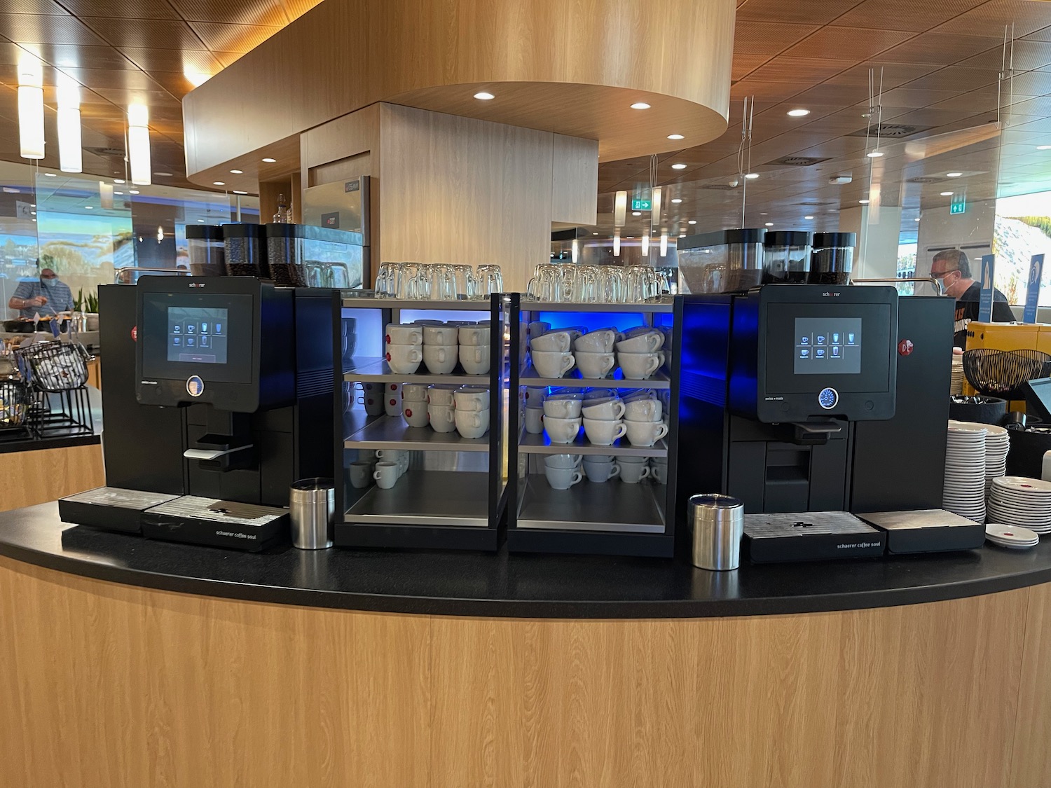 a coffee machine with cups on it