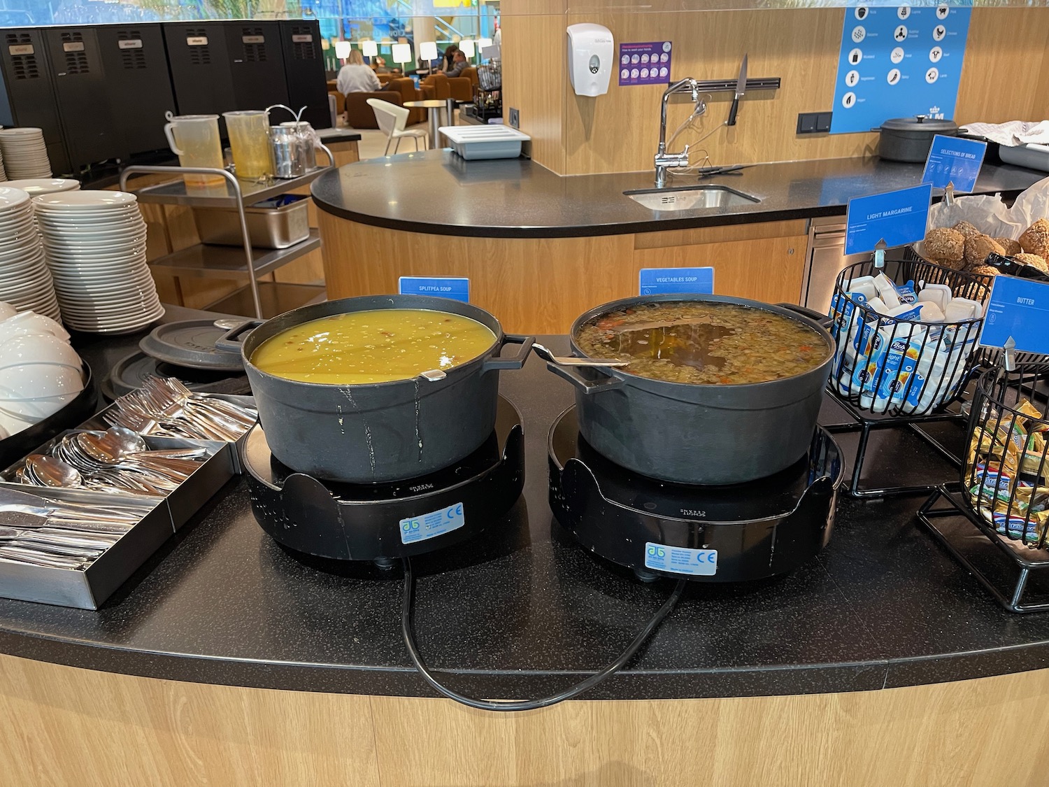 a two pots of soup on a counter