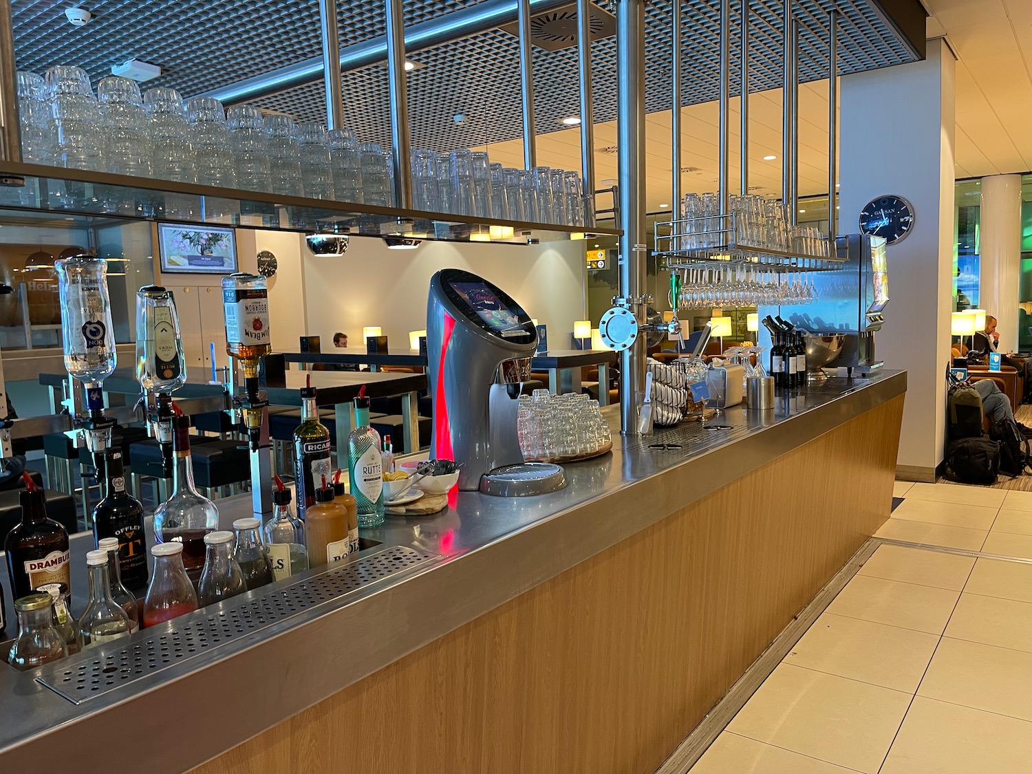 a bar with glasses and bottles on it