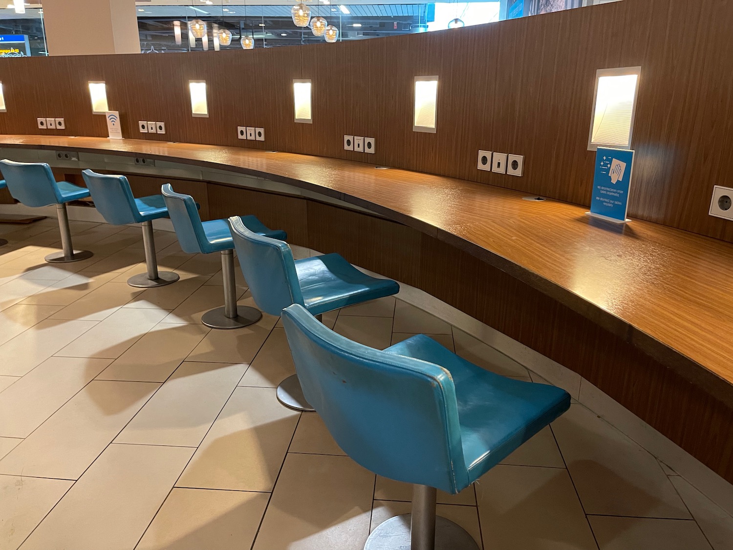 a row of blue chairs in a room