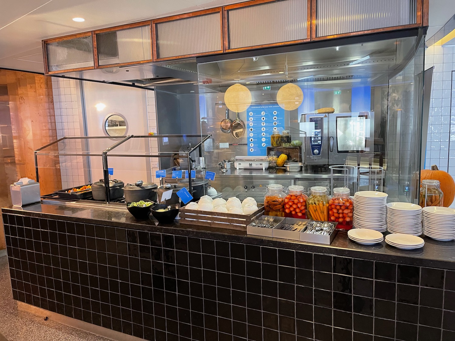 a kitchen with a counter and a glass wall