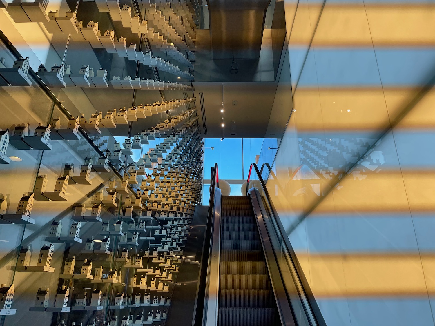 a escalator and a glass wall