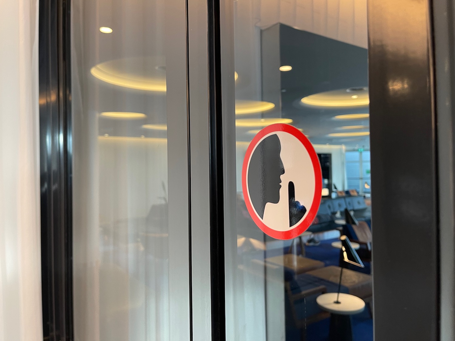 a sign on a glass door