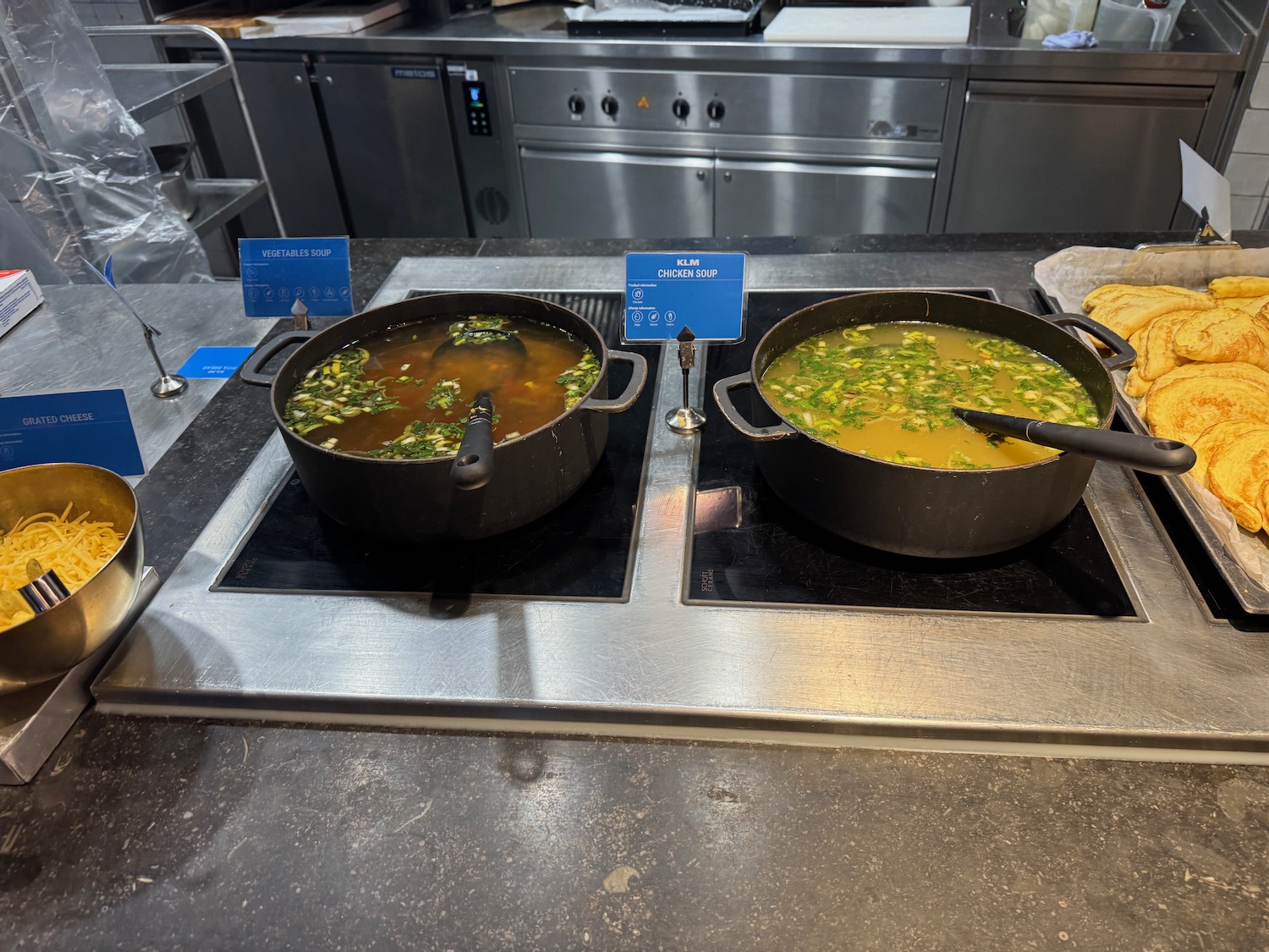 two pots of soup on a stove