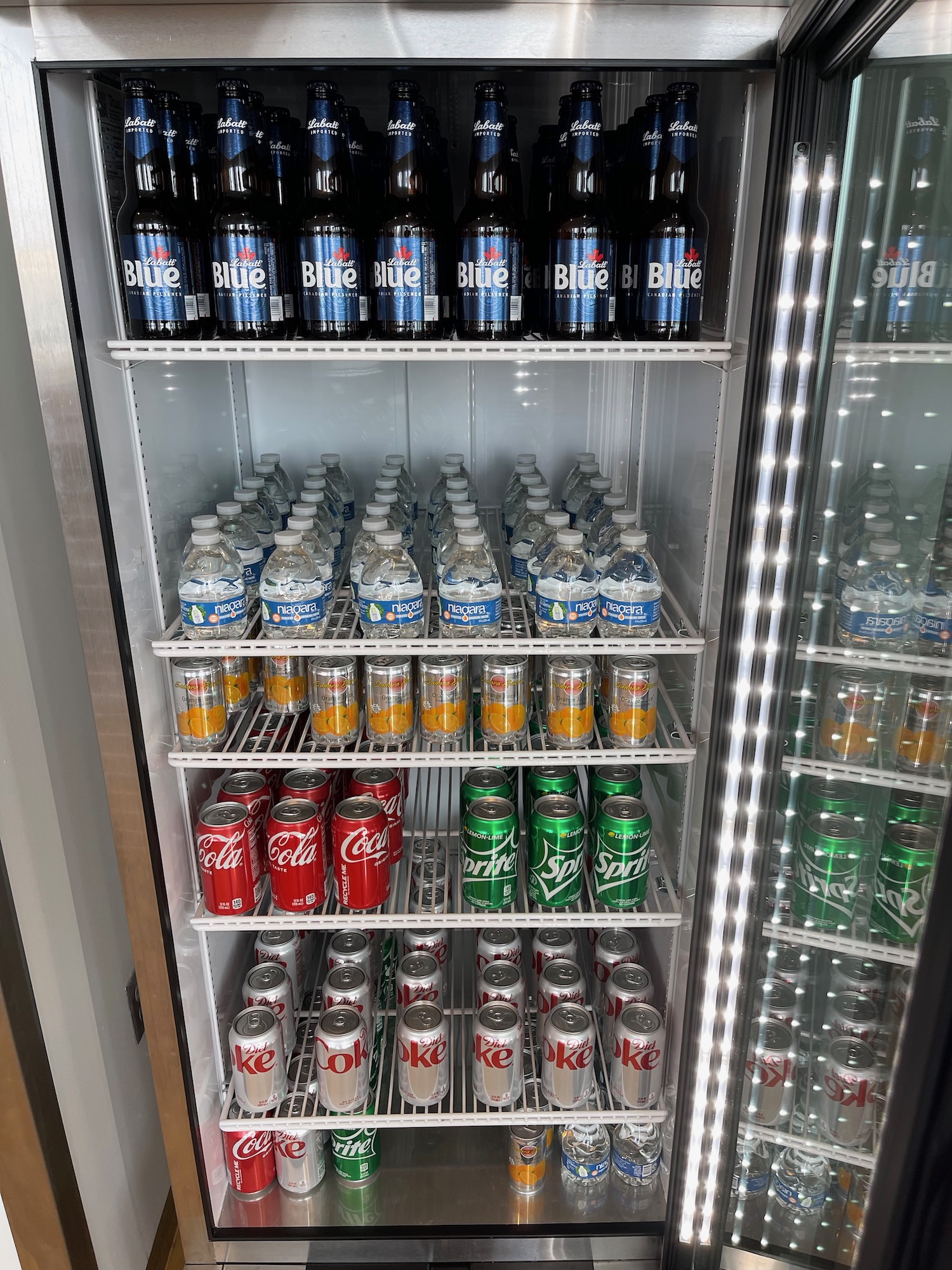 a refrigerator full of soda and water