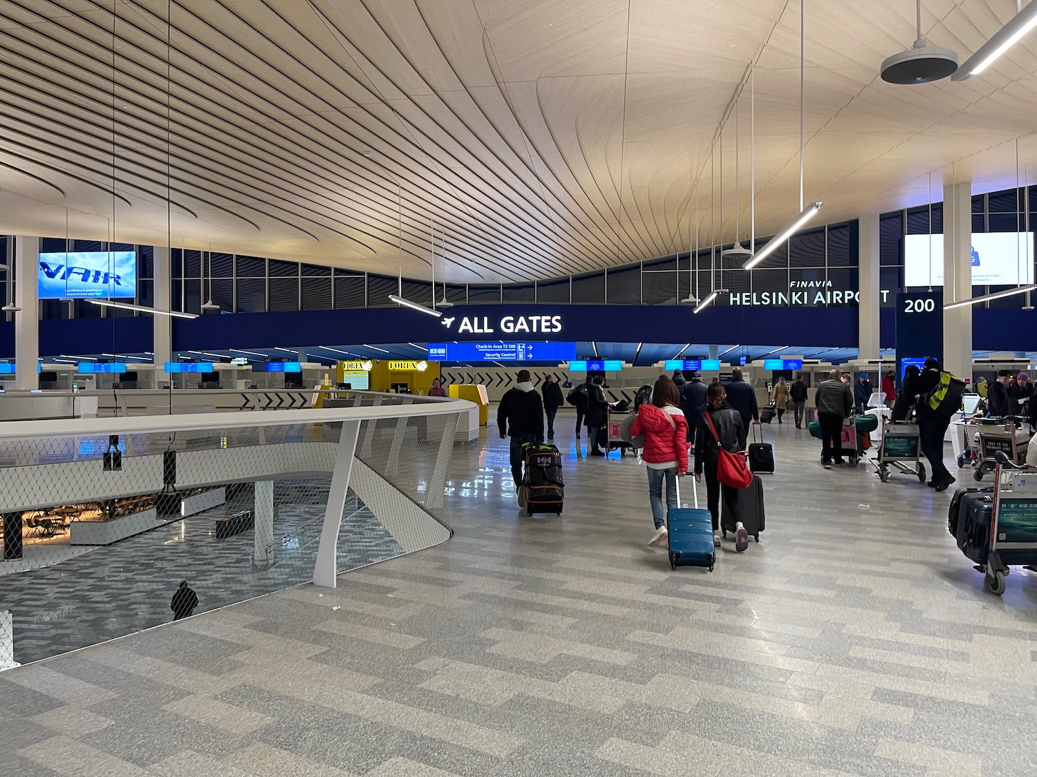 a group of people with luggage in an airport