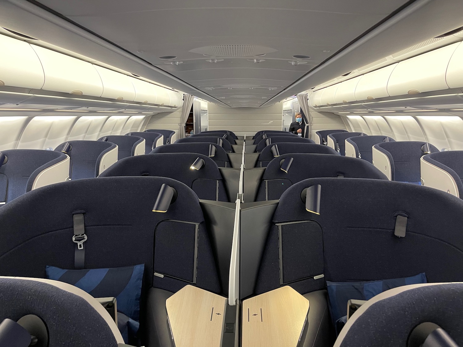 the inside of an airplane with rows of seats