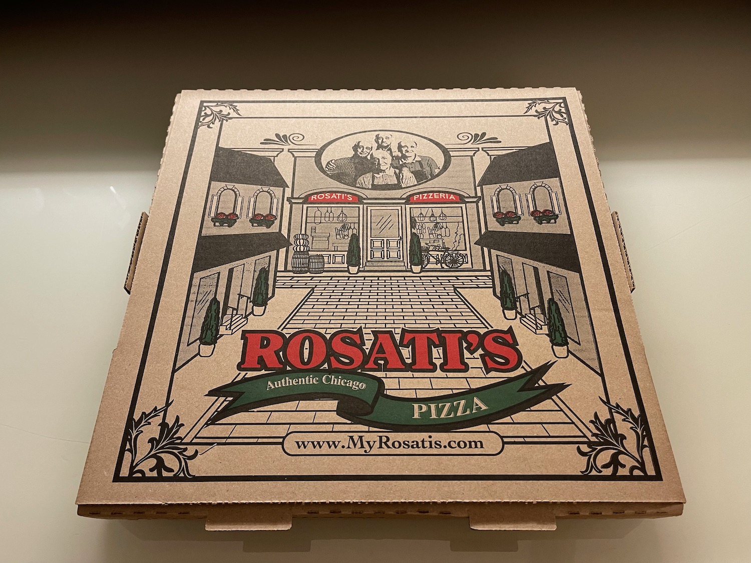 a cardboard pizza box with a picture on it