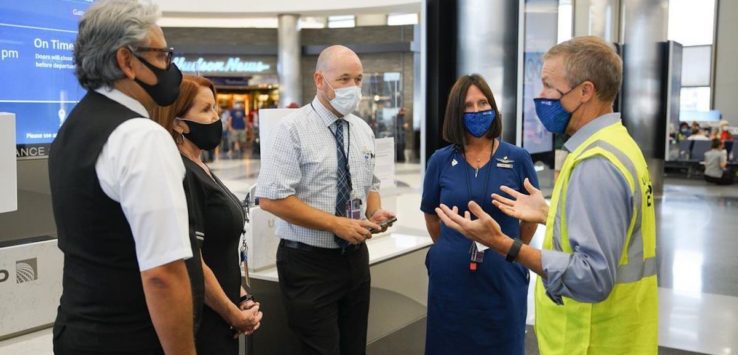 a group of people wearing face masks