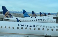 a group of airplanes parked in a row