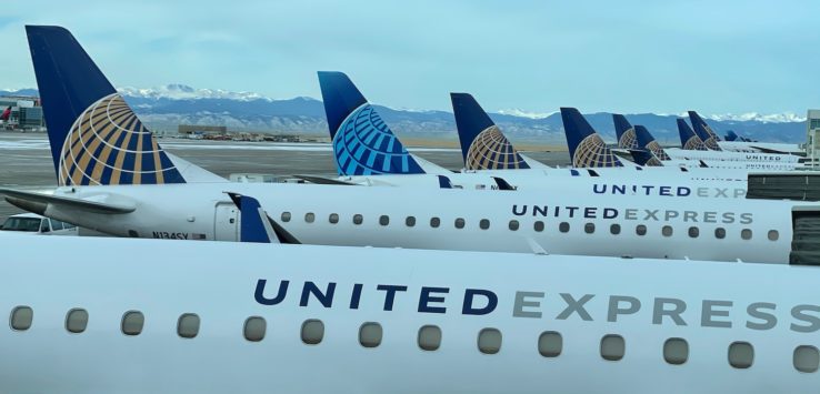 a group of airplanes parked in a row