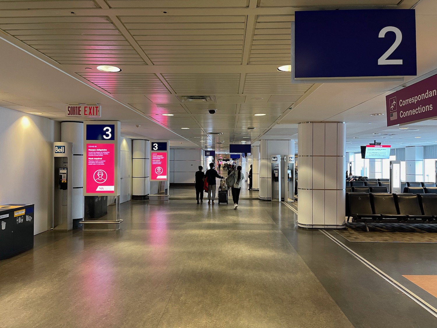 people in a building with signs and people walking