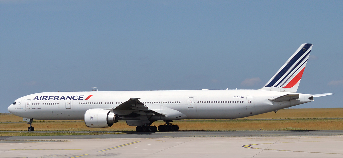 a large white airplane on a runway