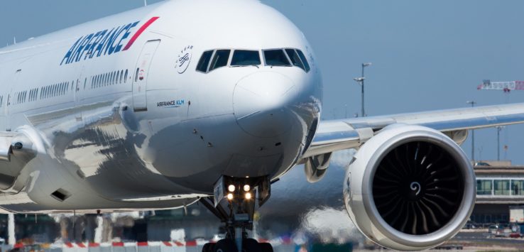 a large white airplane on a runway