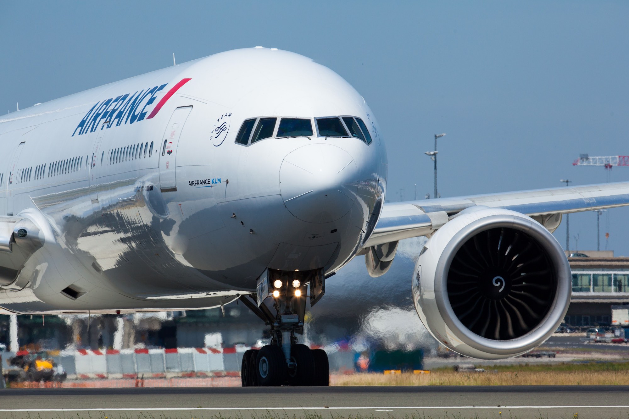 a large white airplane on a runway