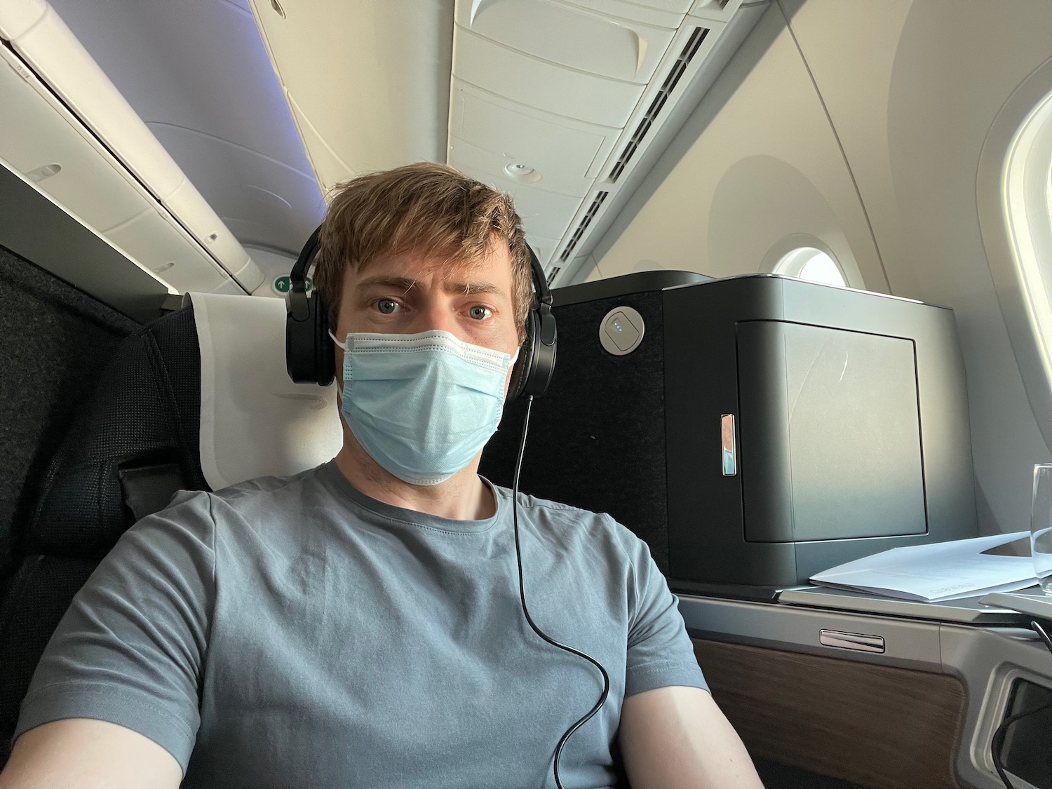 a man wearing a mask and headphones