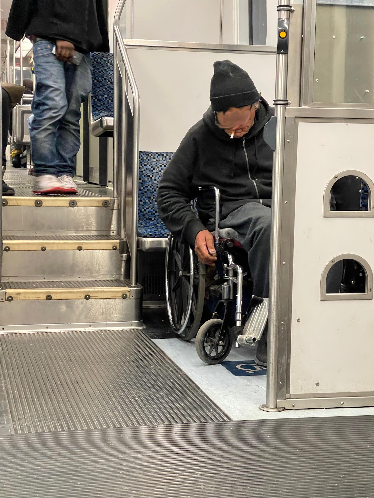 a man in a wheelchair smoking