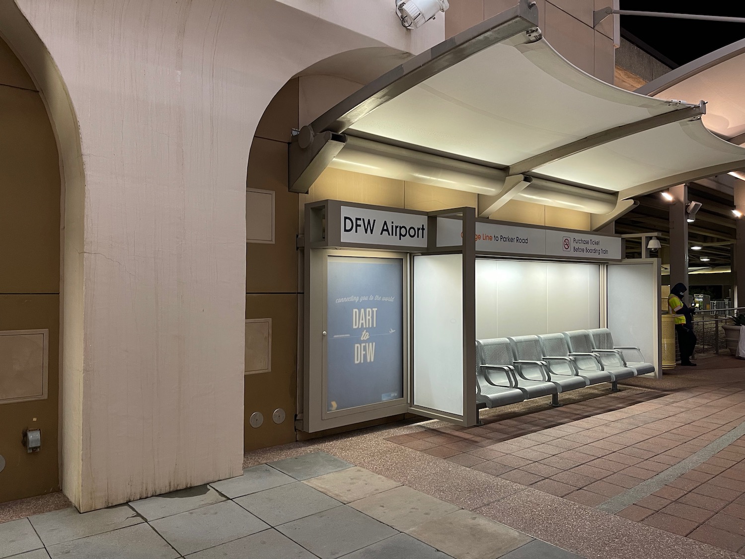 a building with a awning and benches