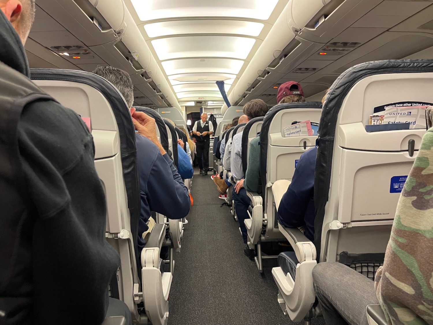 a group of people sitting in an airplane