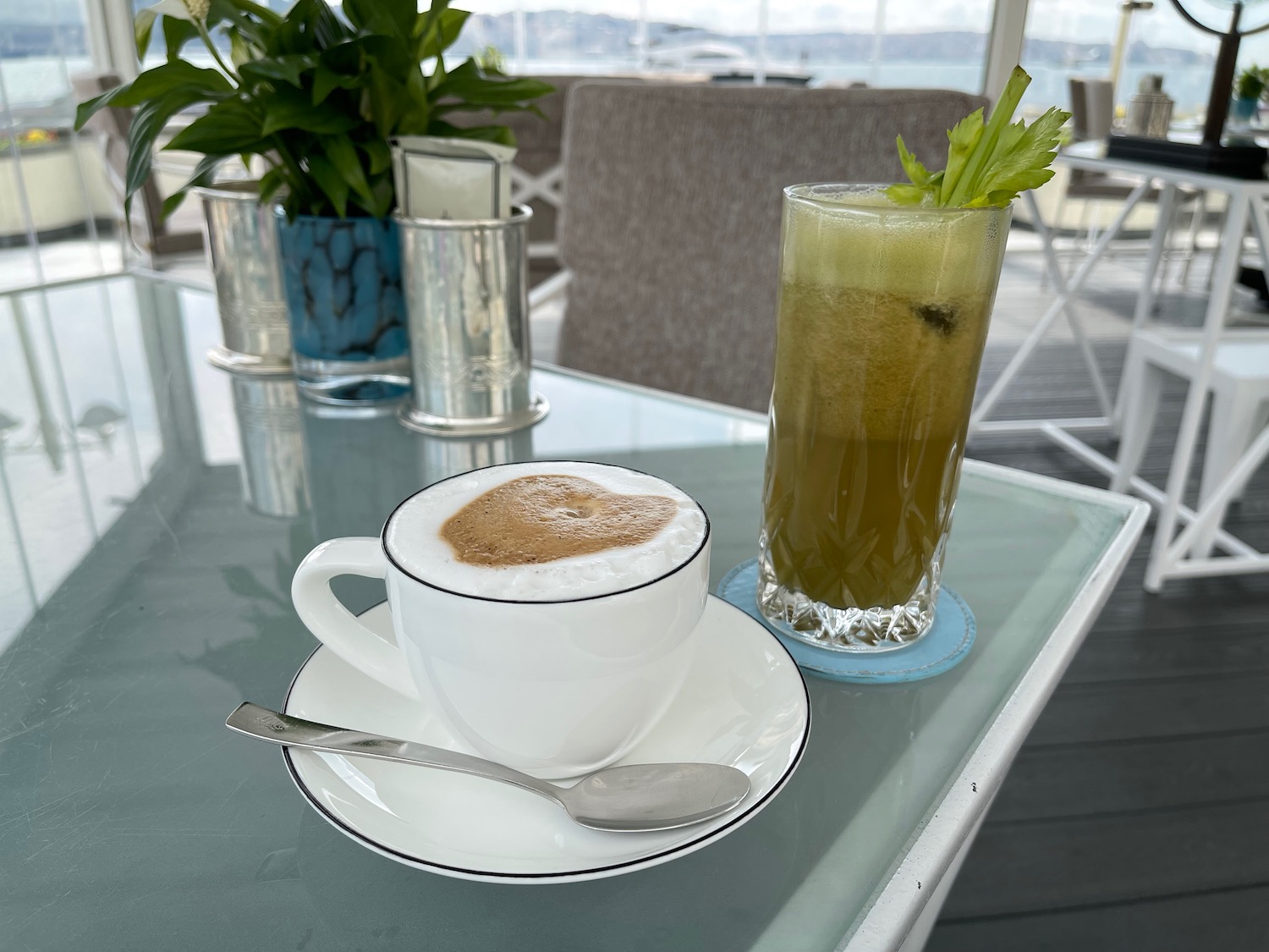 a cup of coffee and a drink on a table