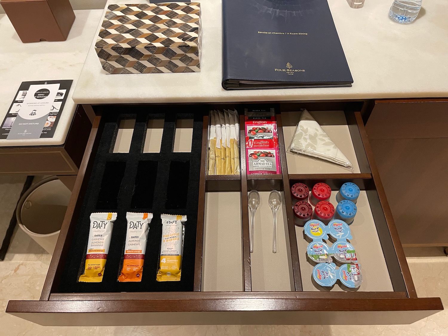 a drawer with food items and a menu