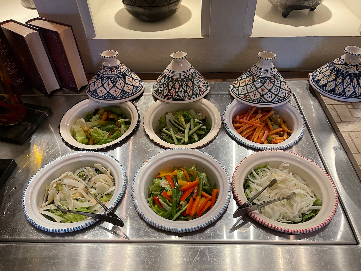 a group of bowls of vegetables on a table