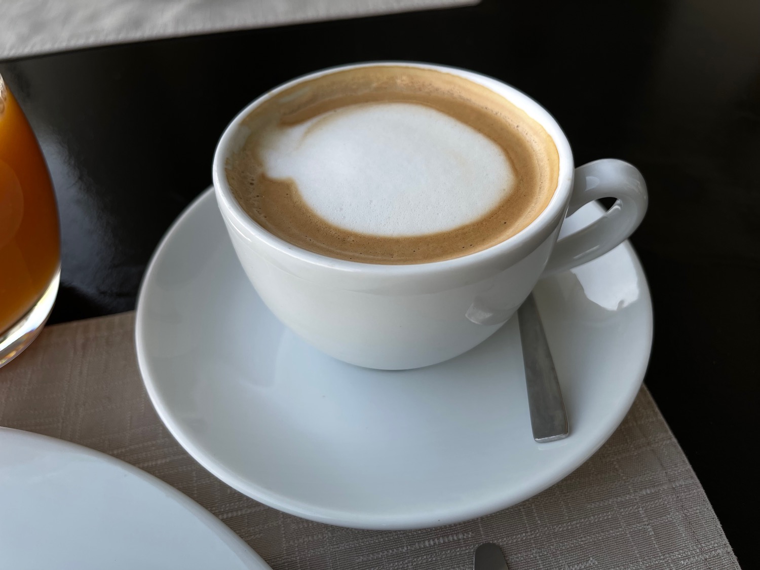 a cup of coffee with a foam in it