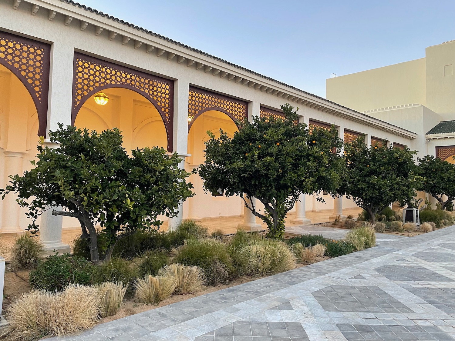 a building with trees and a walkway