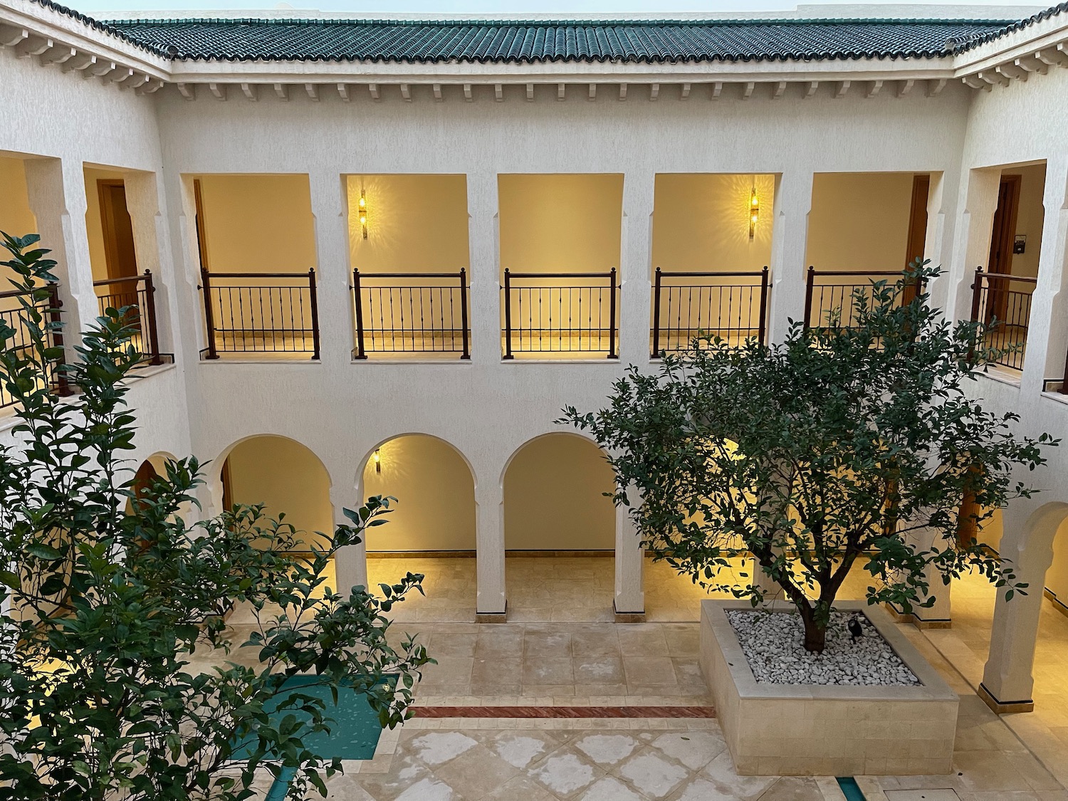 a building with trees and a courtyard