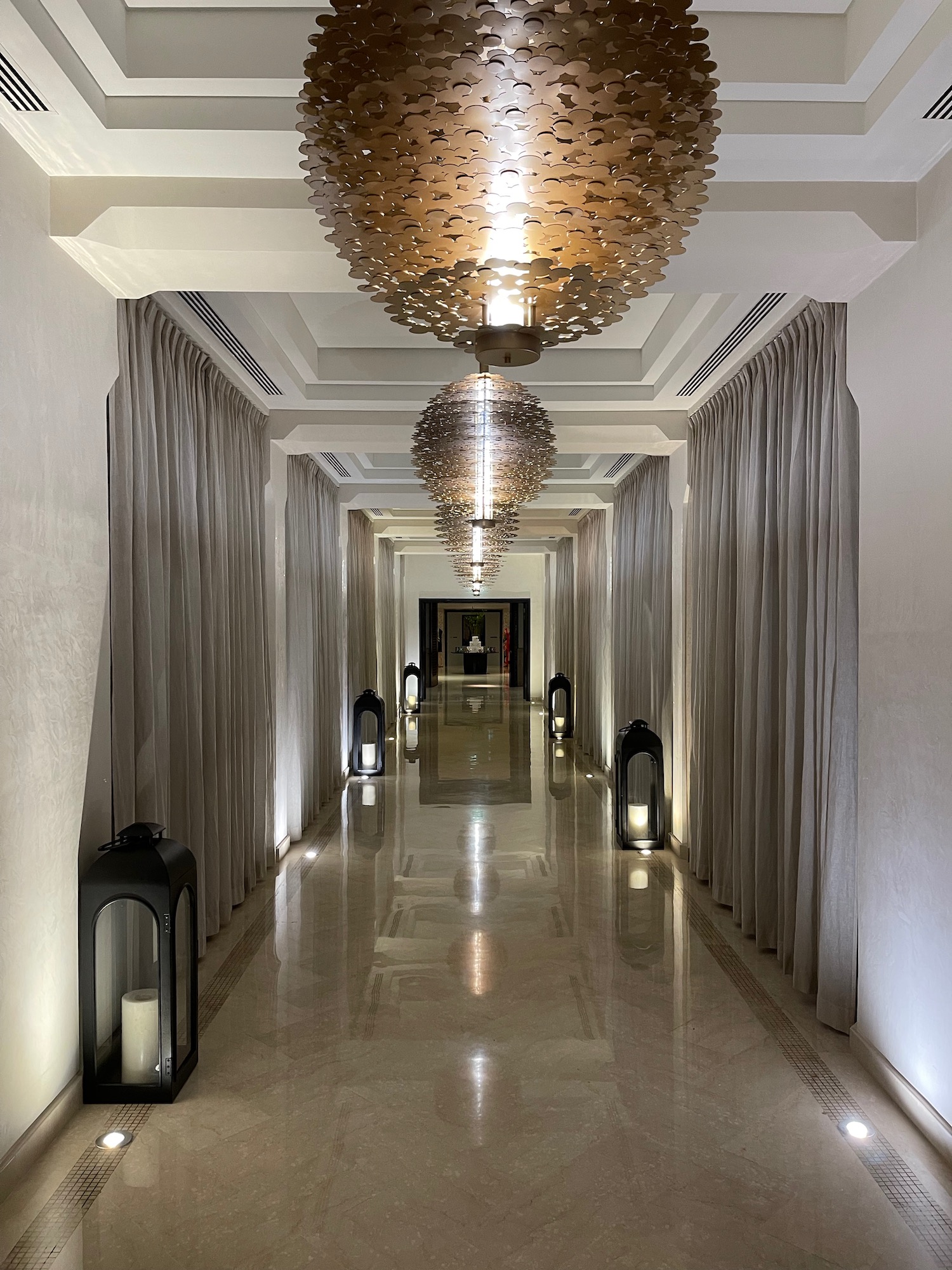 a hallway with lights from the ceiling